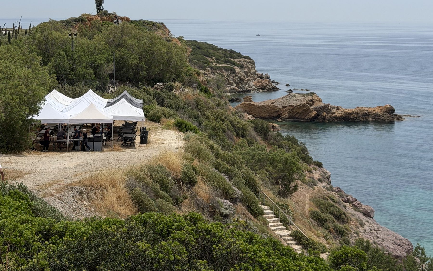 Production basecamp tents overlooking the sea